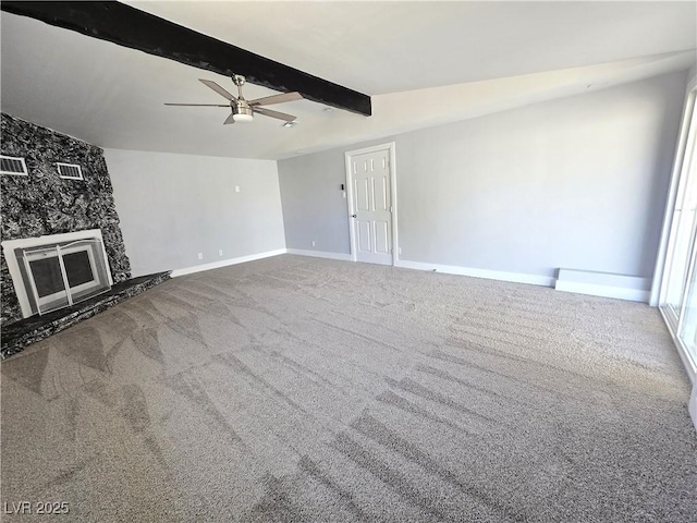 unfurnished living room with ceiling fan, visible vents, beam ceiling, baseboards, and carpet