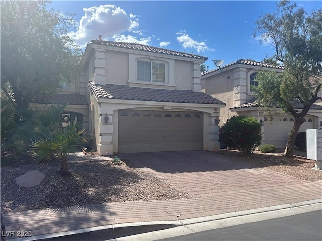 11021 Pentland Downs St, Las Vegas, NV 89141 - mediterranean / spanish home with stucco siding, decorative driveway, a tile roof, and a garage