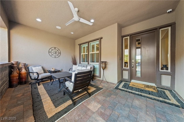 view of patio with ceiling fan and outdoor lounge area