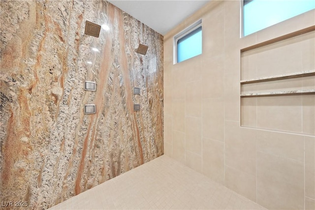 bathroom featuring tiled shower