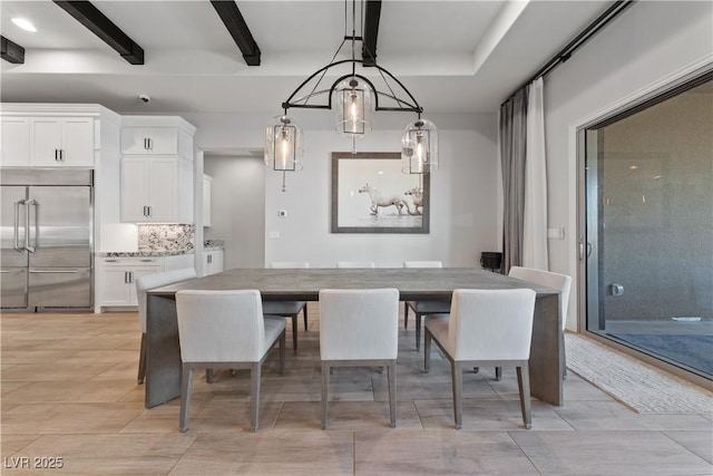 dining area featuring beamed ceiling and light wood-type flooring