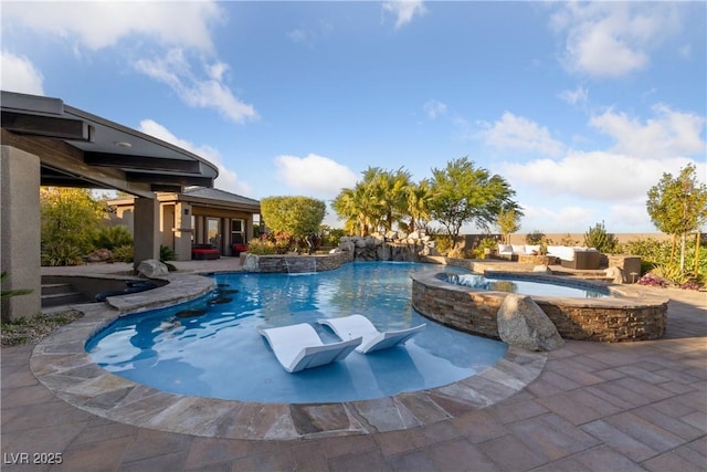 view of pool featuring a patio and a pool with connected hot tub
