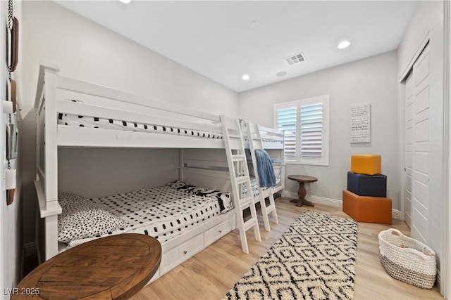 bedroom with recessed lighting, baseboards, visible vents, and light wood-style flooring