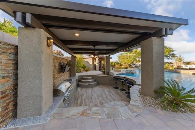 view of patio / terrace with area for grilling, a ceiling fan, and an outdoor pool