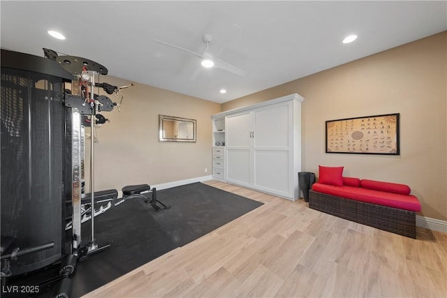 exercise room with baseboards, ceiling fan, recessed lighting, and wood finished floors