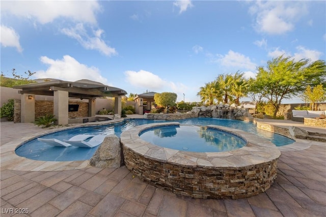 pool featuring a gazebo, a patio, and an in ground hot tub