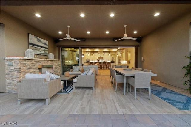 interior space with recessed lighting, a ceiling fan, and wood finished floors