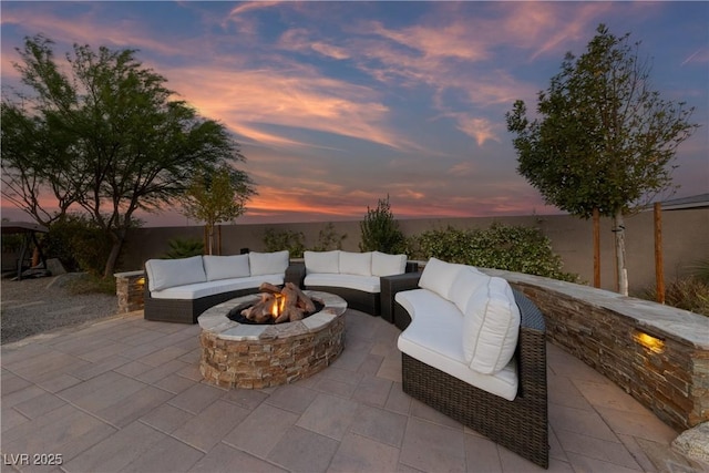 view of patio / terrace with an outdoor living space with a fire pit