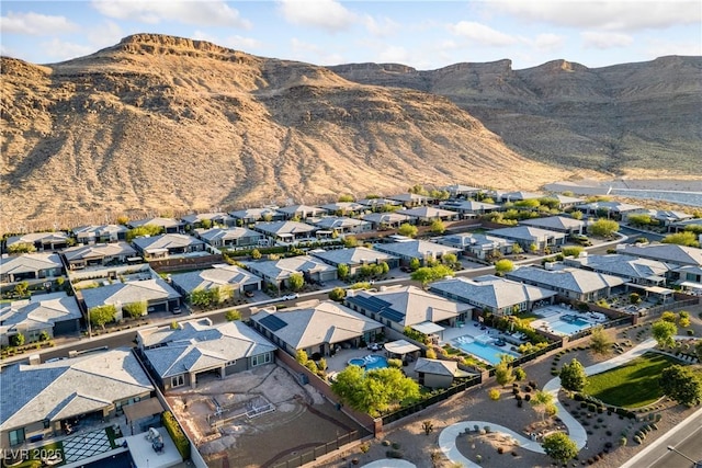 birds eye view of property with a residential view and a mountain view
