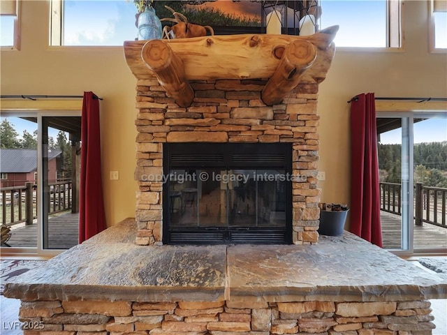 interior details with a stone fireplace