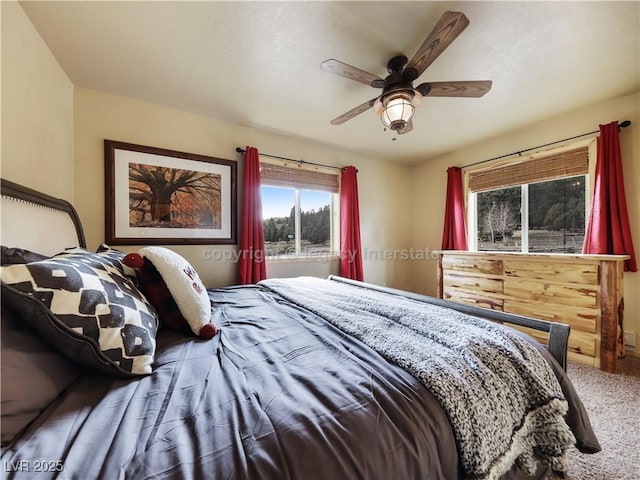 carpeted bedroom featuring ceiling fan