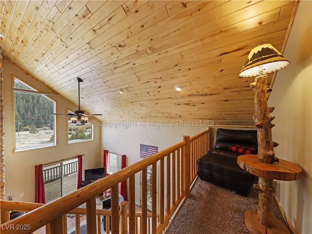 corridor with wood ceiling and lofted ceiling