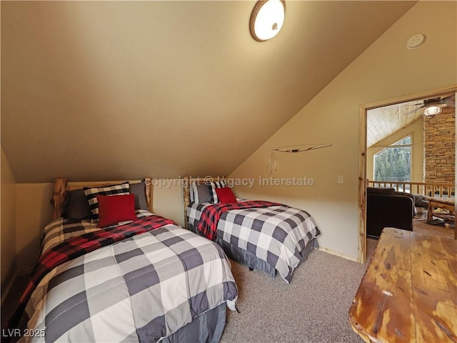 bedroom featuring carpet floors and lofted ceiling