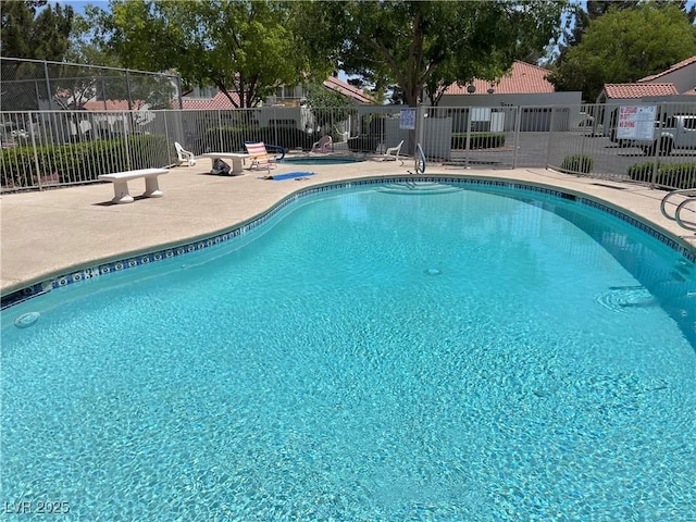 2704 Otter Creek Ct Unit 101, Las Vegas, NV 89117 - community pool featuring a patio area
