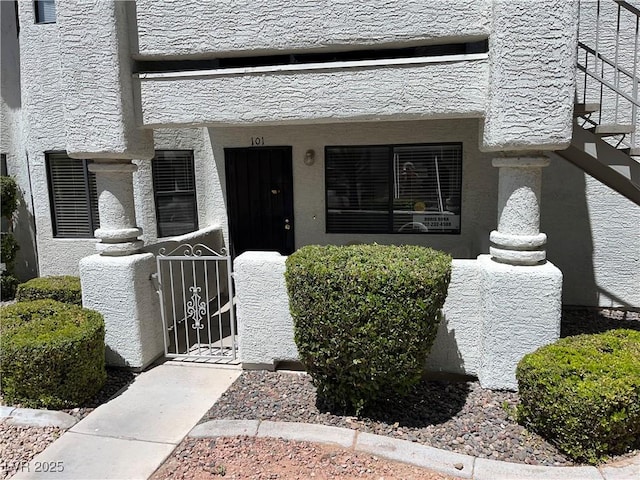 view of exterior entry with a gate