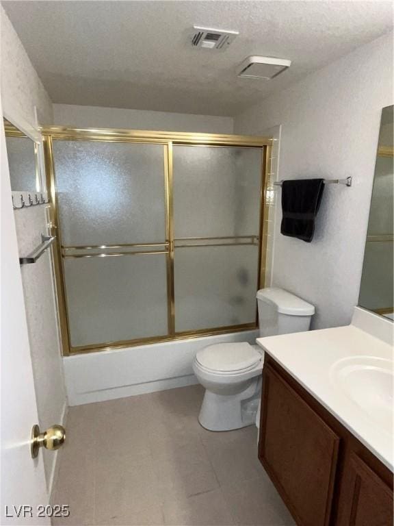 bathroom featuring visible vents, vanity, toilet, a textured ceiling, and combined bath / shower with glass door
