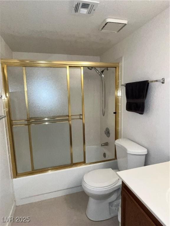 bathroom with enclosed tub / shower combo, toilet, visible vents, and vanity
