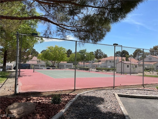 view of sport court with fence