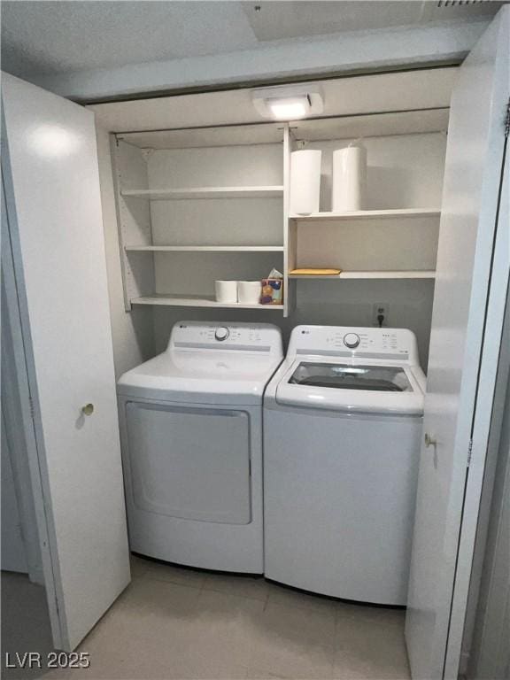 2704 Otter Creek Ct Unit 101, Las Vegas, NV 89117 - laundry area featuring washer and dryer