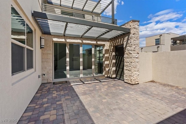 view of patio / terrace featuring fence