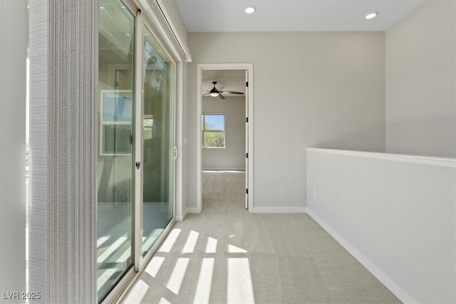 interior space featuring baseboards, a ceiling fan, and recessed lighting
