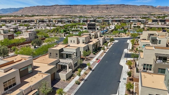 drone / aerial view with a residential view and a mountain view