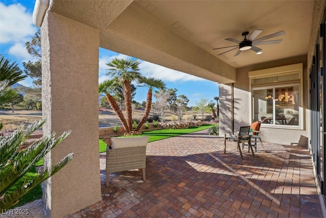 view of patio / terrace featuring ceiling fan