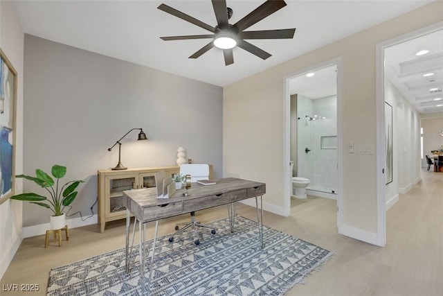 office area featuring baseboards and a ceiling fan