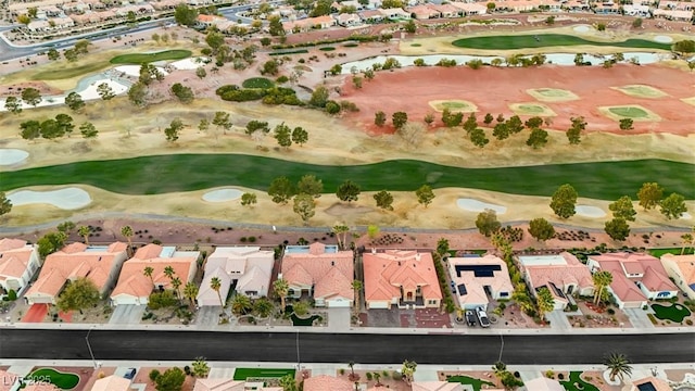 aerial view featuring view of golf course and a residential view
