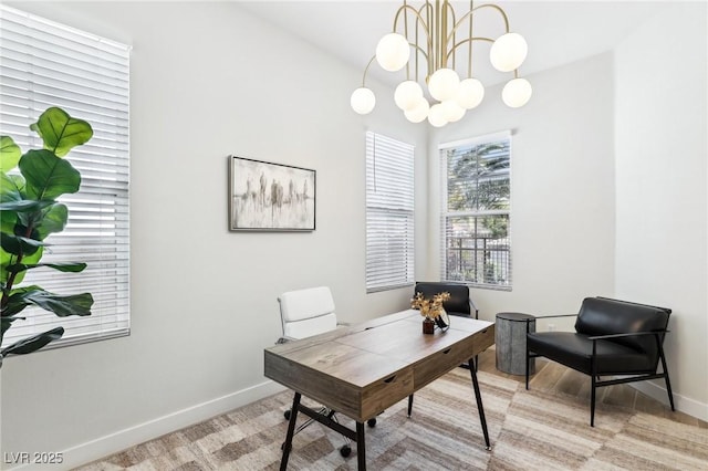 office featuring baseboards and a notable chandelier