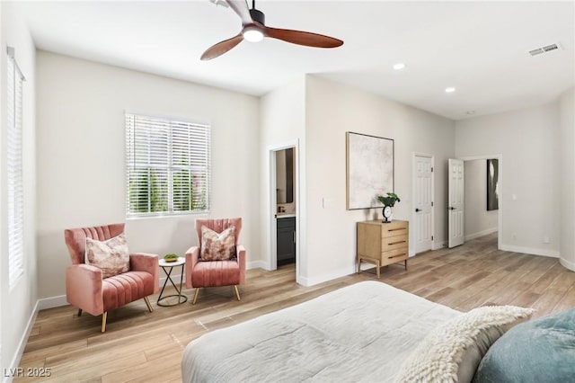 bedroom featuring light wood-style floors, baseboards, and visible vents