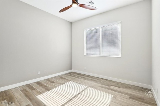 unfurnished room with ceiling fan, visible vents, baseboards, and light wood-type flooring