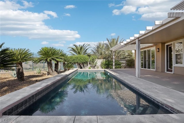 view of swimming pool featuring a patio, a fenced in pool, and a fenced backyard