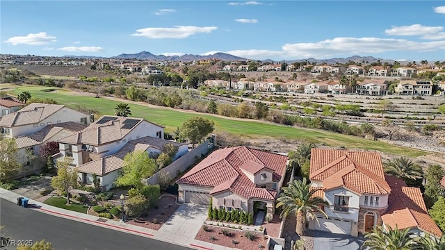 birds eye view of property featuring a residential view, a mountain view, and view of golf course