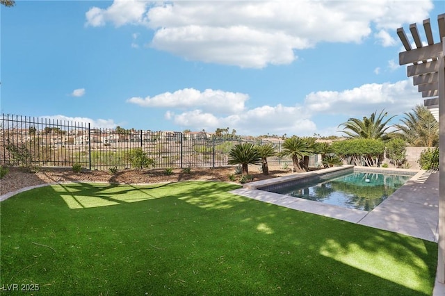 view of pool with a fenced in pool, fence, and a yard