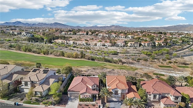 aerial view with a mountain view, golf course view, and a residential view