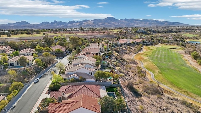 birds eye view of property with view of golf course, a residential view, and a mountain view