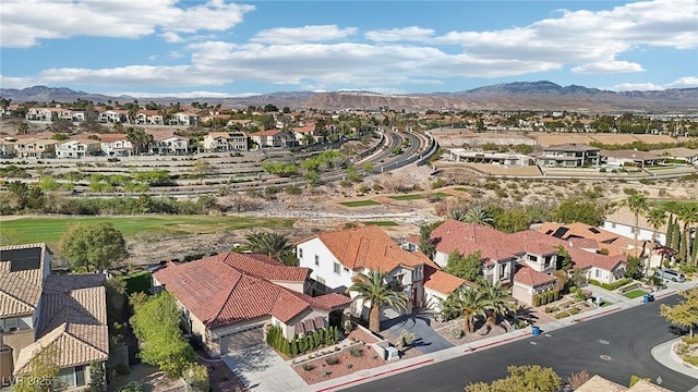 birds eye view of property featuring a mountain view and a residential view