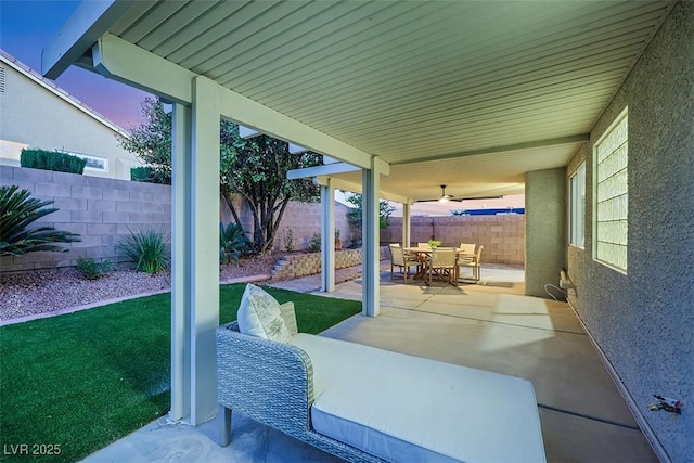 view of patio featuring outdoor dining area and a fenced backyard