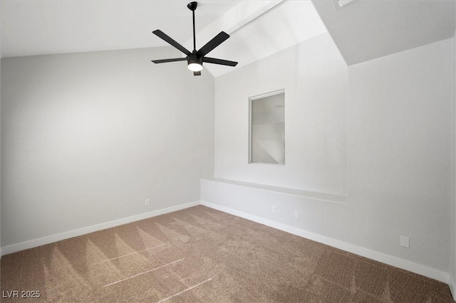 empty room with baseboards, carpet, a ceiling fan, and lofted ceiling