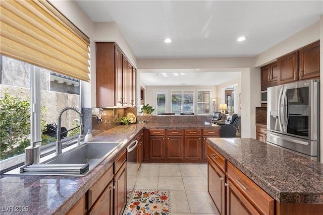 2933 Red Springs Dr, Las Vegas, NV 89135 - kitchen featuring stainless steel appliances, backsplash, light tile patterned floors, recessed lighting, and open floor plan