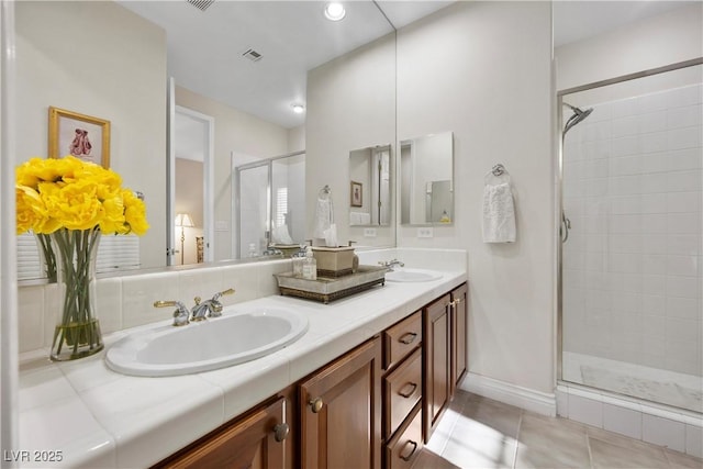 2933 Red Springs Dr, Las Vegas, NV 89135 - bathroom featuring a shower stall, double vanity, and tile patterned floors
