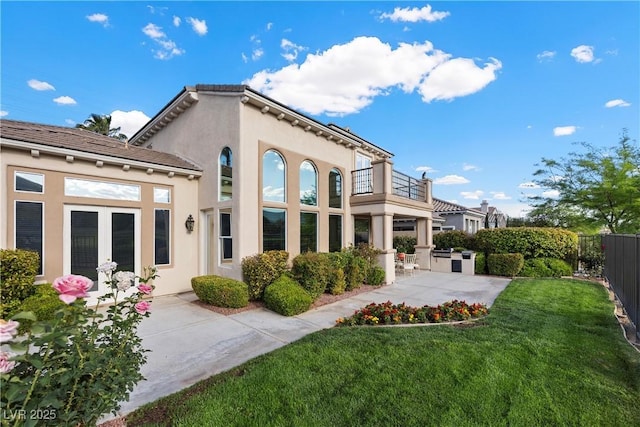 2933 Red Springs Dr, Las Vegas, NV 89135 - back of house featuring a balcony, stucco siding, a patio, and french doors
