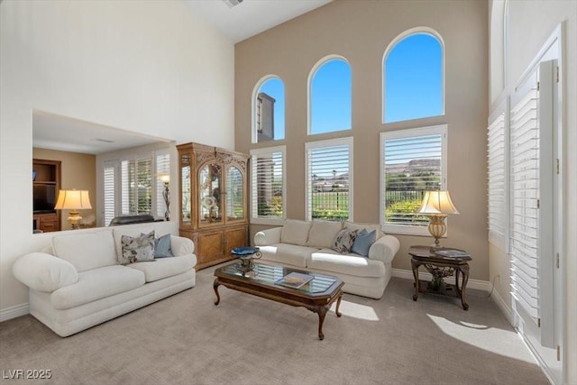 2933 Red Springs Dr, Las Vegas, NV 89135 - carpeted living area featuring a towering ceiling and plenty of natural light
