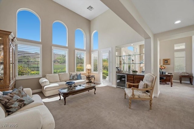 2933 Red Springs Dr, Las Vegas, NV 89135 - living room with wine cooler, carpet flooring, and a high ceiling