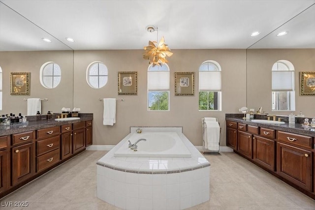 2933 Red Springs Dr, Las Vegas, NV 89135 - bathroom with two vanities, a garden tub, recessed lighting, and tile patterned flooring