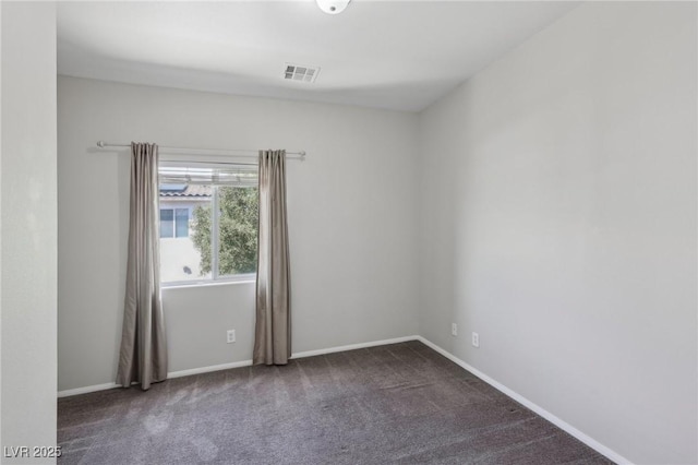 unfurnished room featuring baseboards, carpet flooring, and visible vents