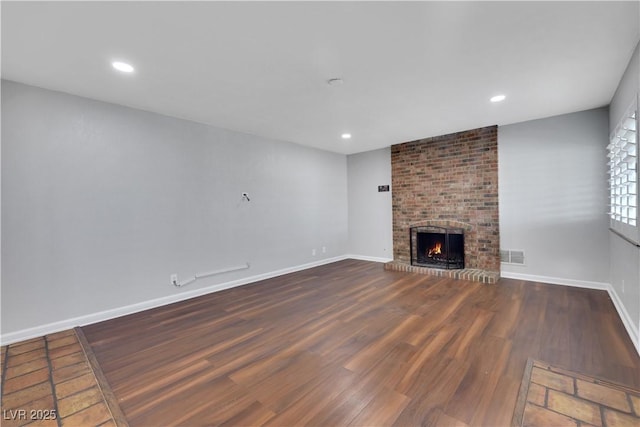 4680 Freshwater Dr, Las Vegas, NV 89103 - unfurnished living room with visible vents, wood finished floors, a fireplace, baseboards, and recessed lighting