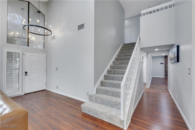 4680 Freshwater Dr, Las Vegas, NV 89103 - foyer featuring visible vents, baseboards, a towering ceiling, and a notable chandelier