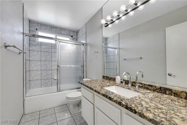 4680 Freshwater Dr, Las Vegas, NV 89103 - bathroom with vanity, tile patterned floors, combined bath / shower with glass door, and toilet